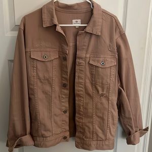 AG distressed denim jacket in blush/pink